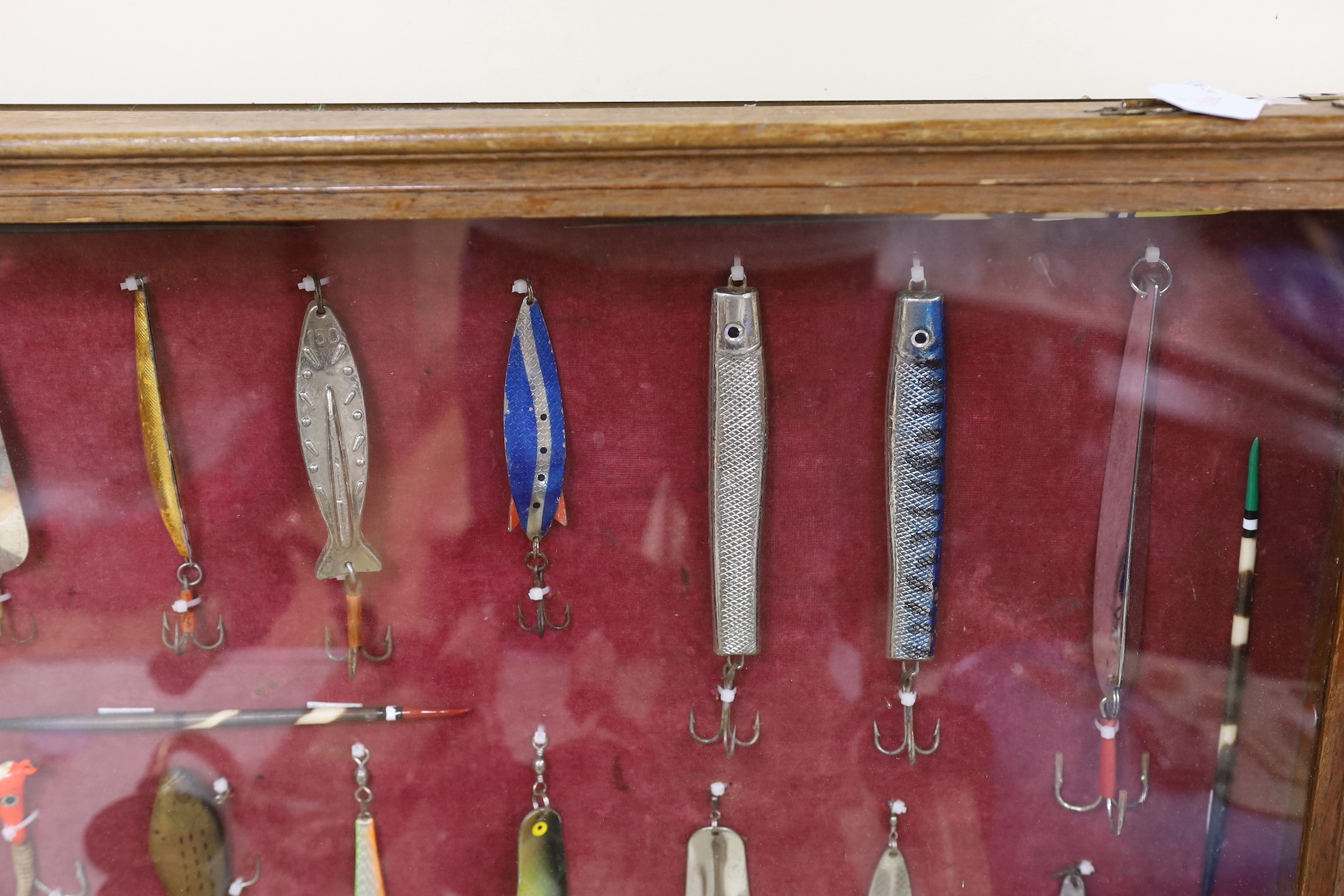 Two cased sets of fishing lures